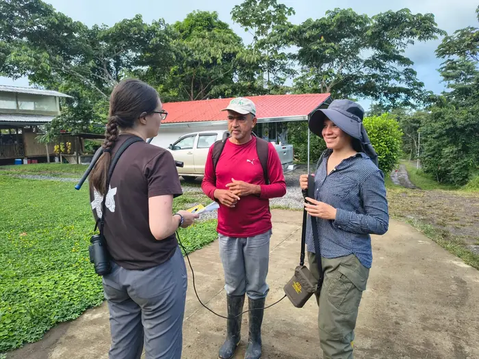 Martha discussing radio telemetry with Jorge and Belén before a tracking session